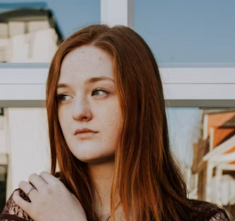 a young girl in front of the city