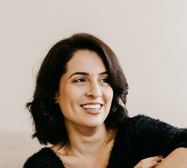 a smiling woman with brown hair
